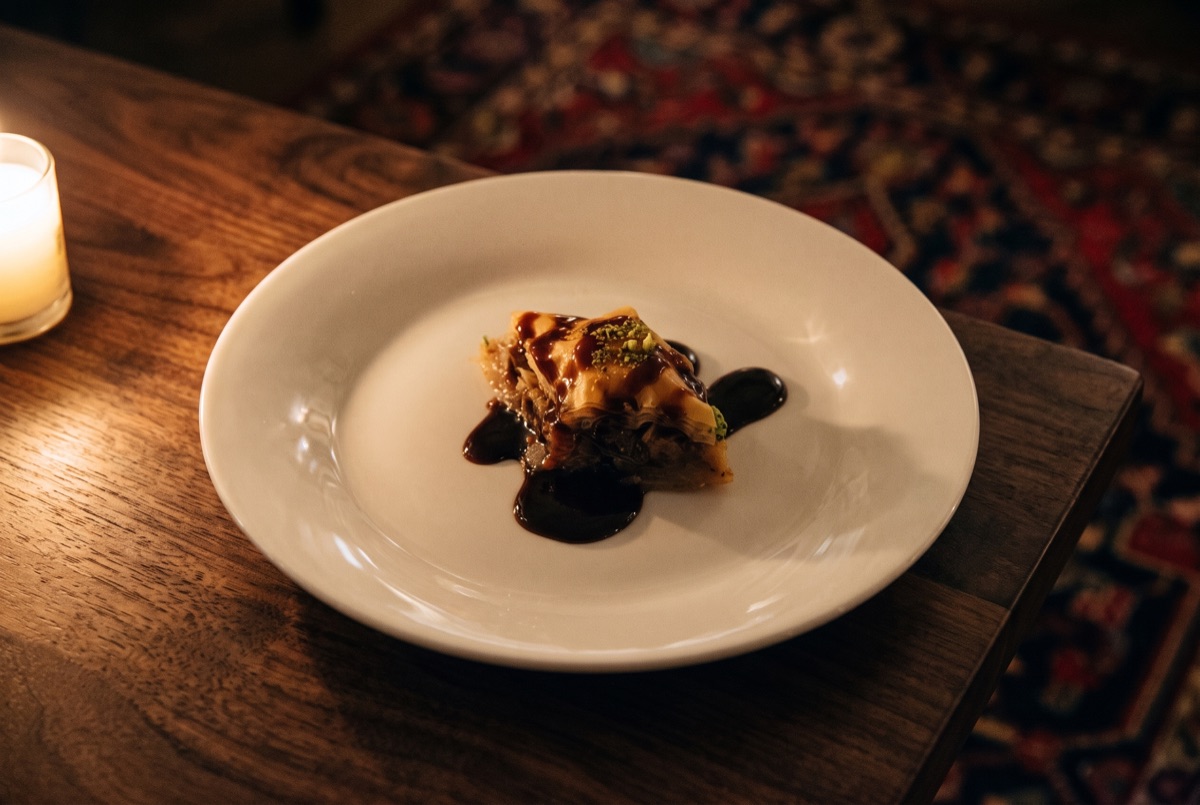 Baklava · Layers of paper-thin phyllo brushed with butter, filled with chopped nuts, baked golden and soaked in sweet syrup.