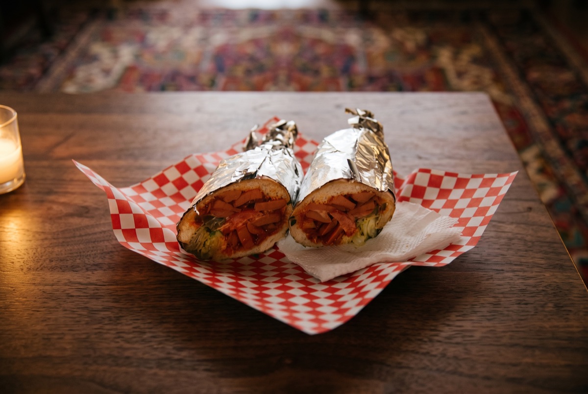 Bandari · Spicy sliced hot dog pan-seared with potato and tomato in warming Persian spices, wrapped warm as a hand-held street…