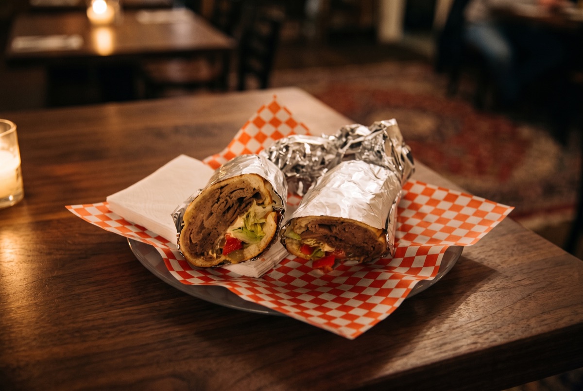 Beef Gyro · Shaved beef, slow-roasted on a vertical spit and thinly carved, wrapped warm with fresh vegetables and creamy…