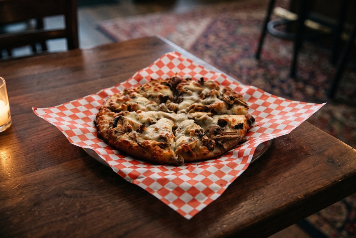 Steak & Mushroom Pizza · Hand-stretched dough topped with seared steak, sauteed mushrooms, and melted mozzarella, baked until…