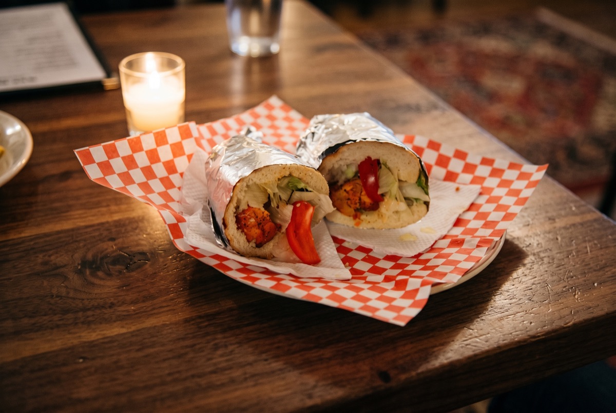 Chicken · Tender chicken breast, grilled and thinly sliced, tucked into fresh bread with crisp vegetables and a savory sauce.