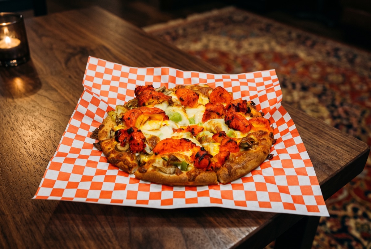 Chicken Pizza · Hand-stretched dough topped with tender chicken, sauteed mushrooms, sweet bell peppers, and melted mozzarella,…