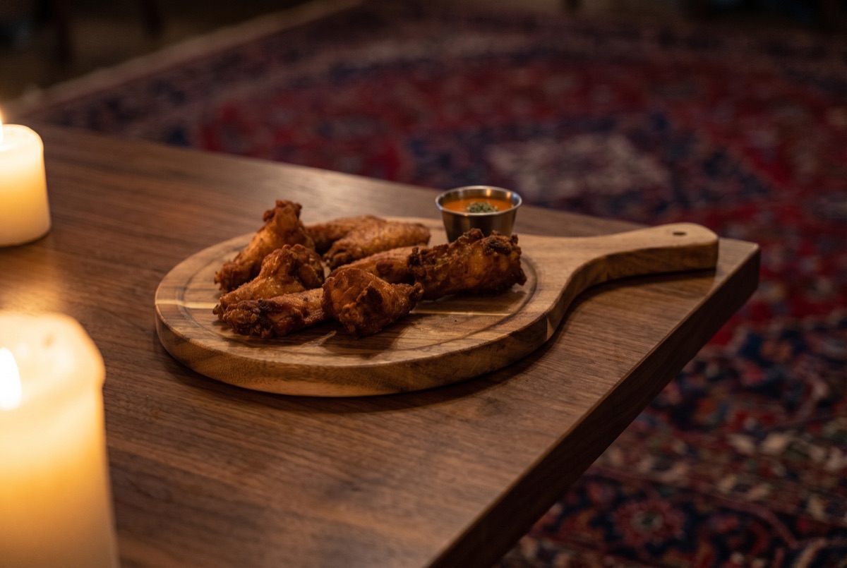 Chicken Wings · Crispy golden deep fries chicken wings marinated in spicy sauce served with our special sauce.
