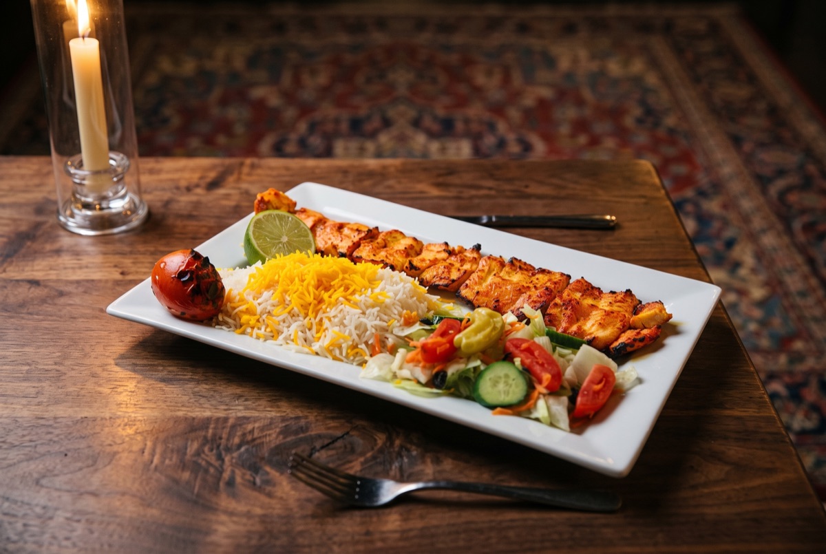 Chicken Barg Kebab · Saffron- and lemon-marinated chicken fillet, threaded onto skewers and charcoal-grilled until juicy with…