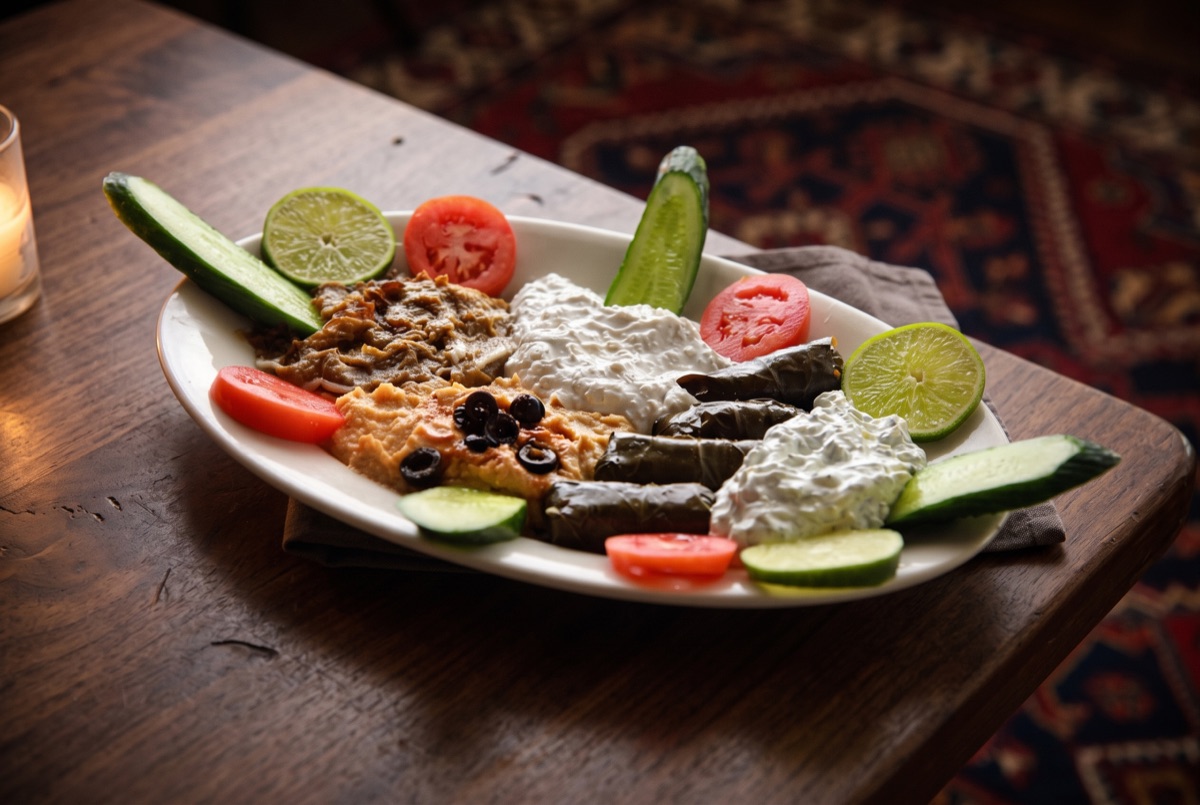 Combo Appetizer · Hummus, Shallot and Yogurt, Dolmeh, Tzatziki and Eggplant dish.