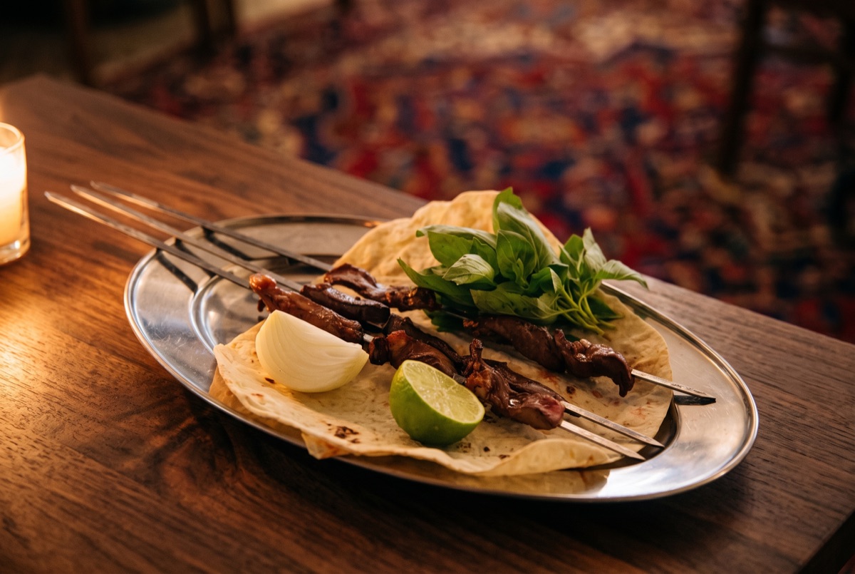 Del o Jigar · Charcoal-grilled skewers of lamb heart and liver, a classic Persian offal kabob seasoned simply and seared until…