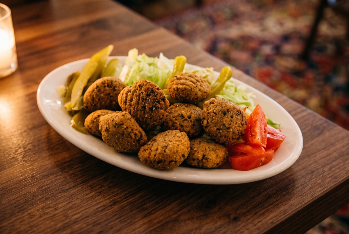 Falafel Plate · Crisp-fried patties of seasoned chickpeas and herbs, golden outside and tender within, plated with warm bread…