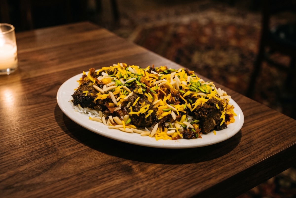 Gheymeh Nesar Qazvin · A festive Qazvin specialty: saffron rice layered with tender meat, barberries, slivered almonds,…