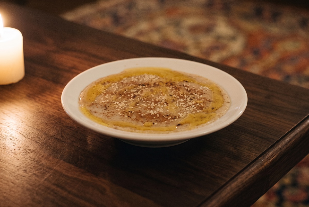 Halim Qazvin · Qazvin-style haleem: wheat and shredded meat slow-simmered for hours into a creamy porridge, finished with…