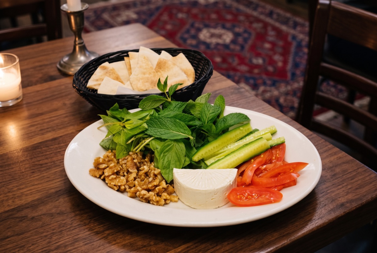 Noon Panir Sabzi · A classic Persian spread of warm flatbread, tangy feta cheese, and a bundle of fresh herbs, simple,…