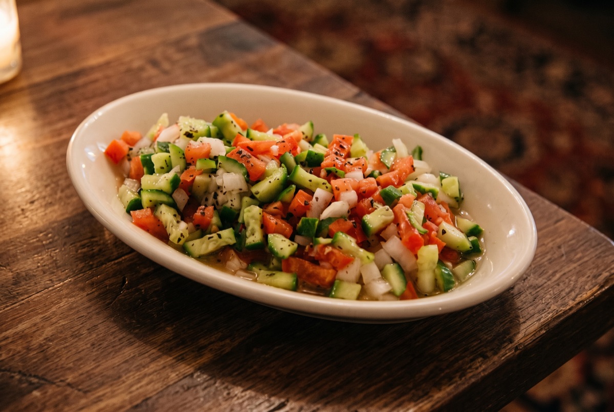 Shirazi Salad · A Persian classic of finely diced cucumber, tomato, and onion, tossed with lime juice and dried mint for a…