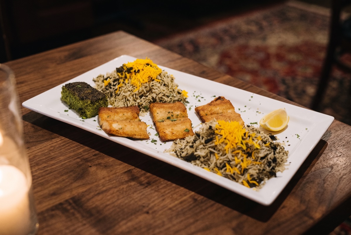 White Fish with Sabzi Polo and Koo Koo Sabzi · Saffron white fish paired with herbed sabzi polo rice and koo koo sabzi, a…