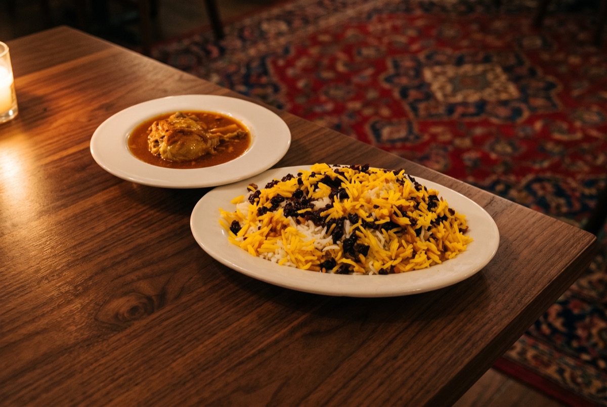 Zereshk Polo + Chicken · Steamed basmati rice mixed with barberries served with juicy marinated chicken.