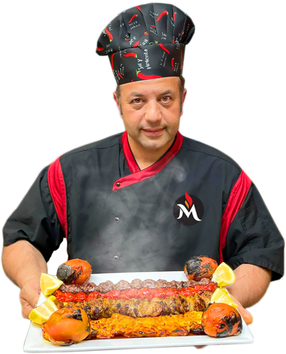 Chef and owner Martin Karimi presenting a steaming platter of saffron and beef koobideh kebabs
